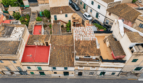 Aerial view of historic townhouses with terracotta roofs, terraces and courtyards in Felanitx, Mallorca