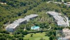 Aerial view of modern penthouse complex in Bendinat with pool, green spaces and pine forest