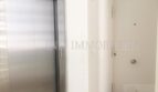 Elevator area in the stairwell of the modern penthouse apartment in Bendinat with stainless steel elevator