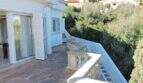 Großzügige Terrasse mit Steinbalustrade und Panoramablick auf Grünflächen, Villa in Cala Mandia, Porto Cristo Novo